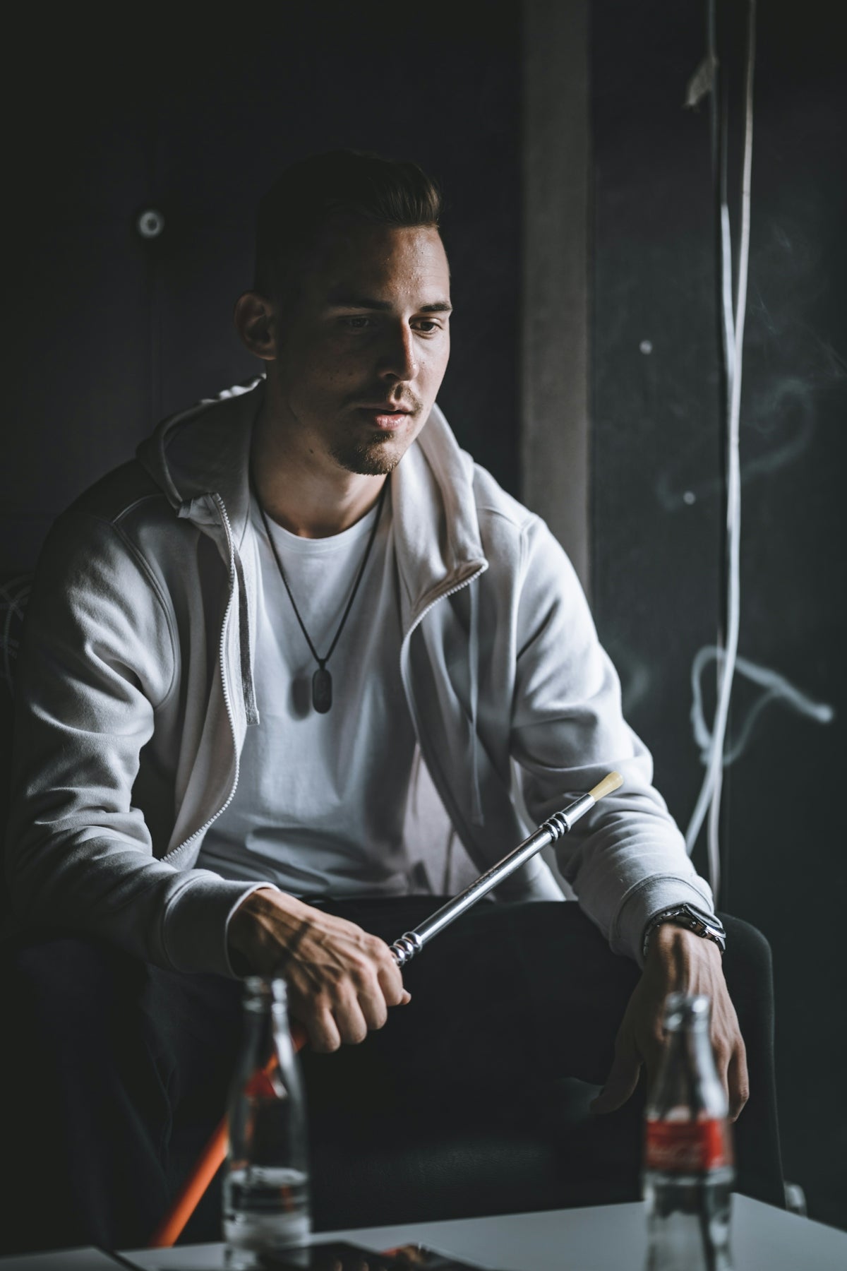 man holding a hookah