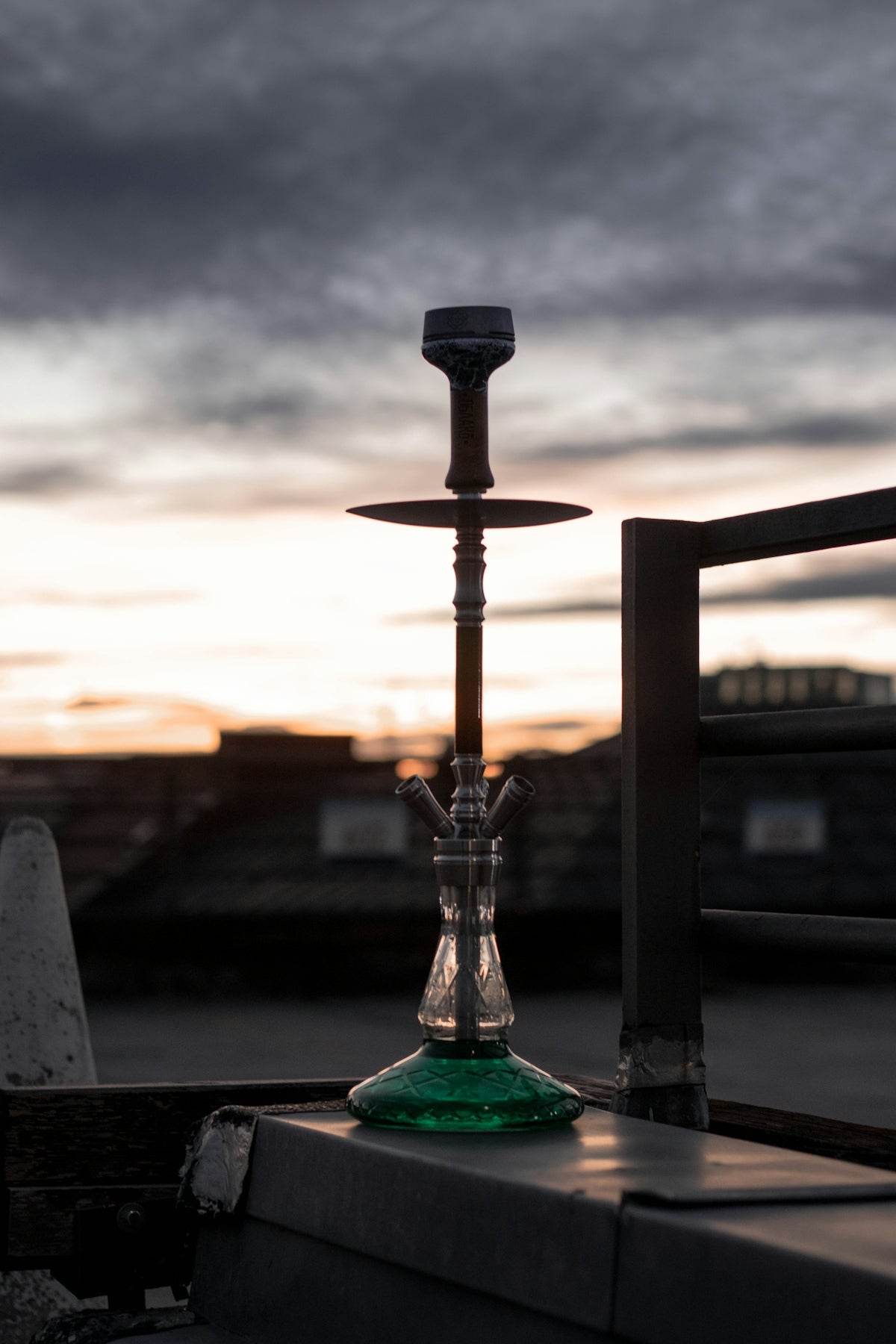 green glass bottle on table