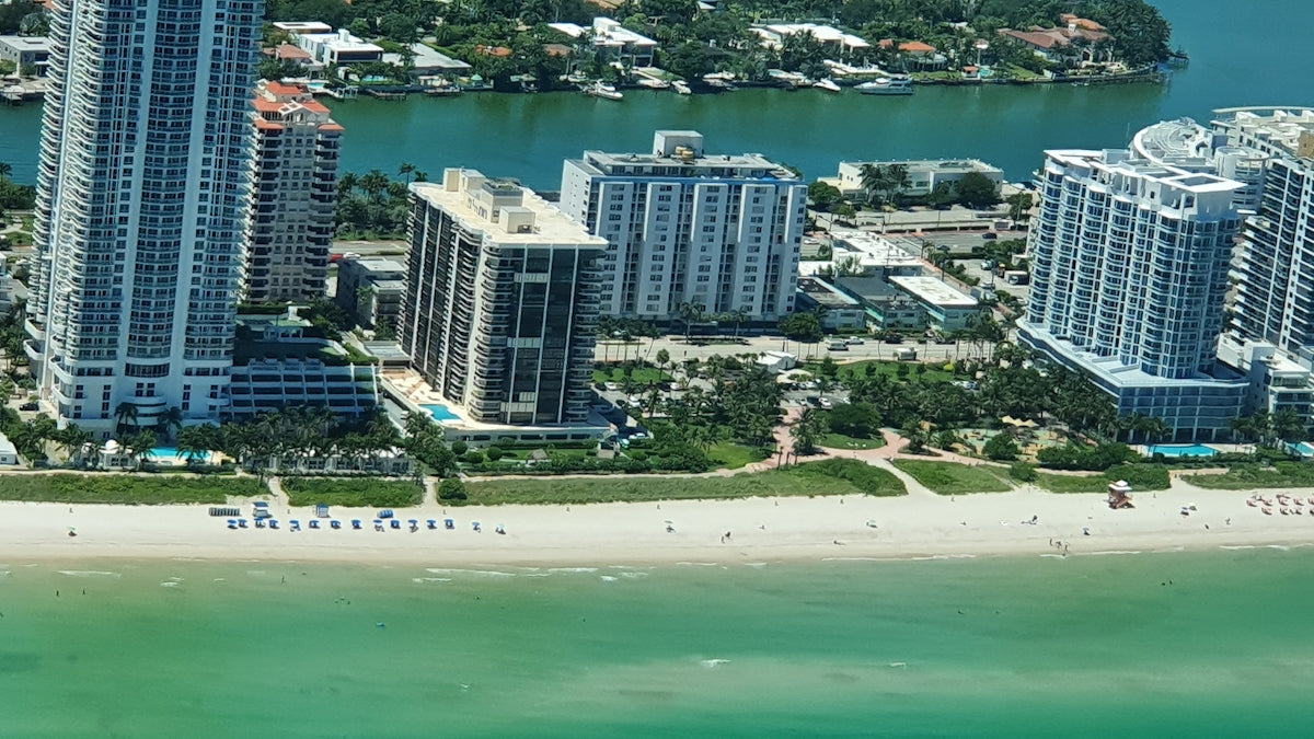 high rise buildings near body of water during daytime