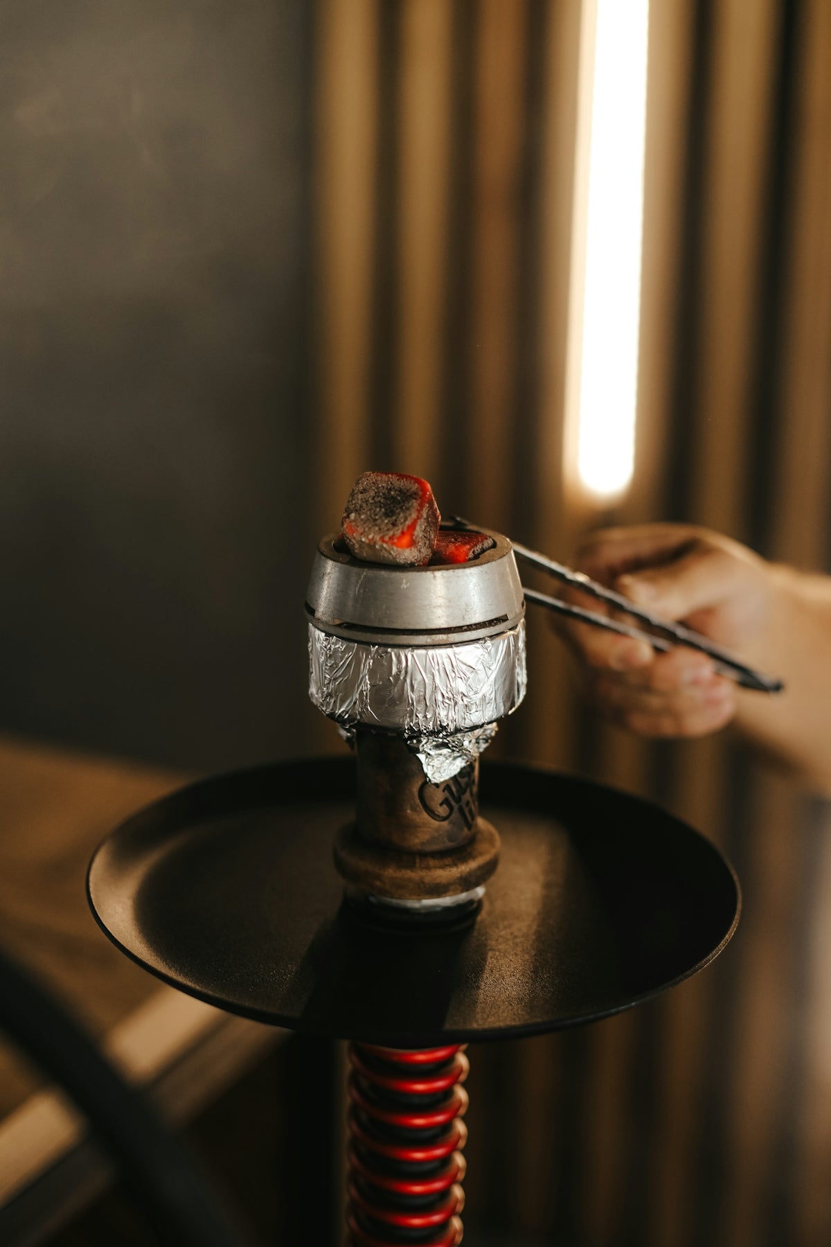 a hand holding a metal object