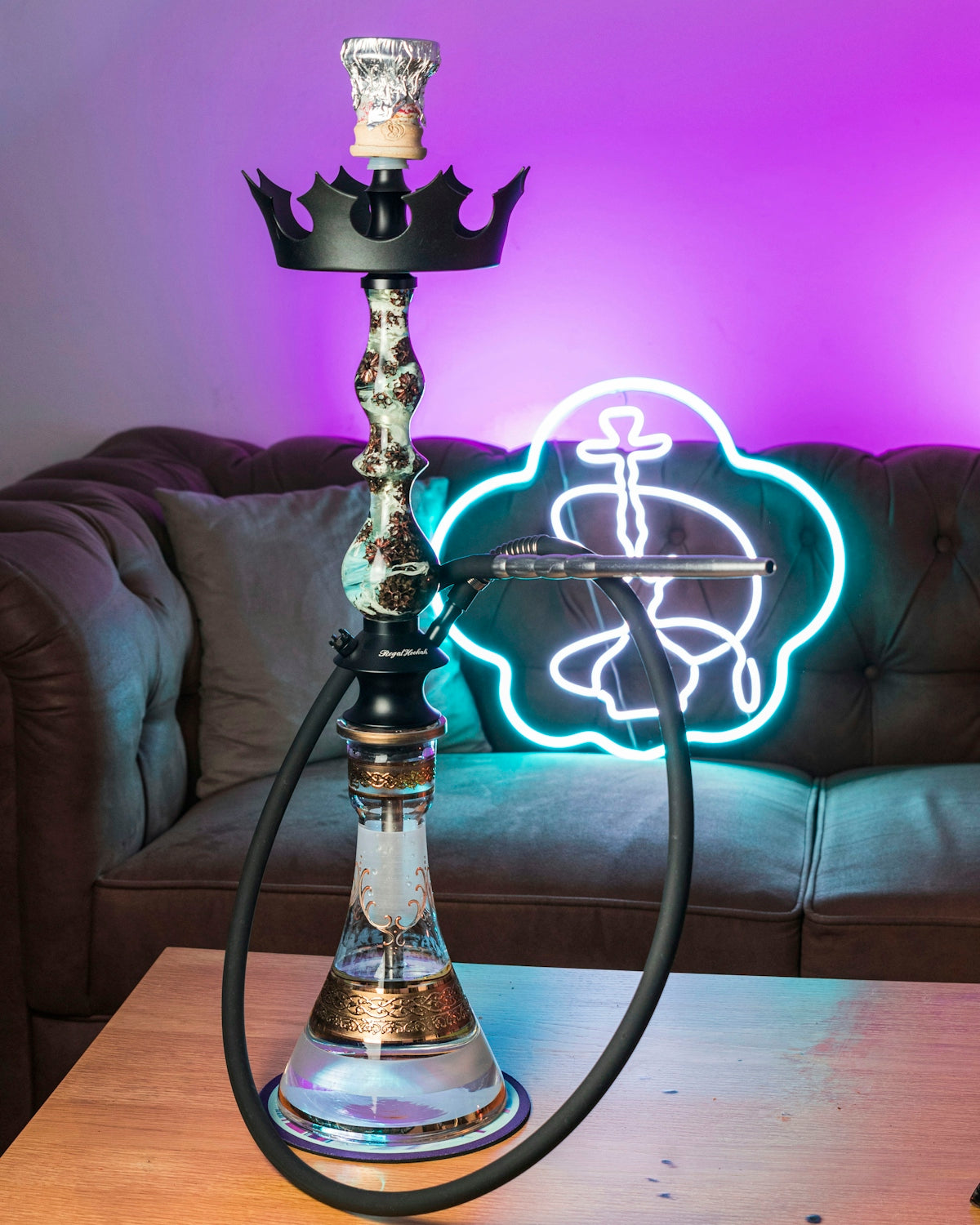 a hookah lamp sitting on top of a wooden table