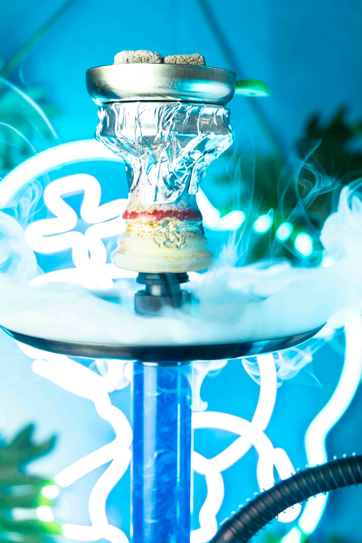 a close up of a water fountain with a blue background